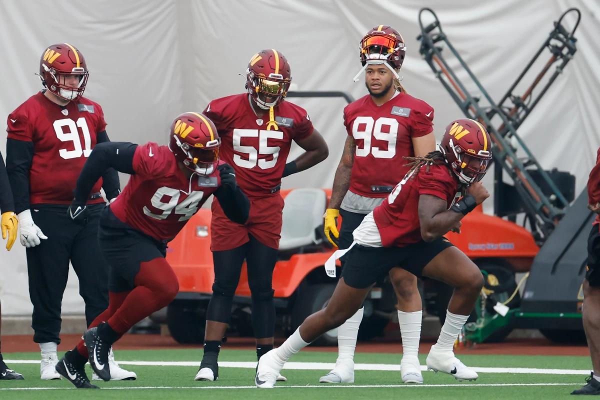The Washington Commanders defensive line practicing